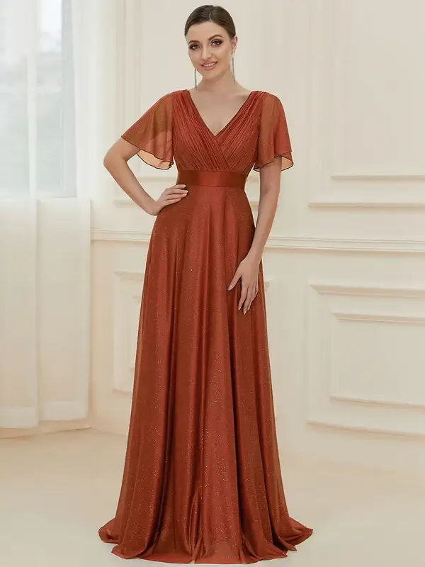 ey50159 burnt orange glitter aline long evening gown with flutter sleeves eternally yours